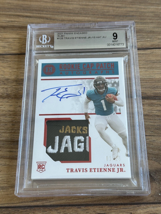 2021 Panini Encased Ruby Travis Etienne Jr./15 HAT AU #128 BGS 9